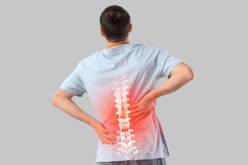 A man experiencing pain or discomfort in the spine