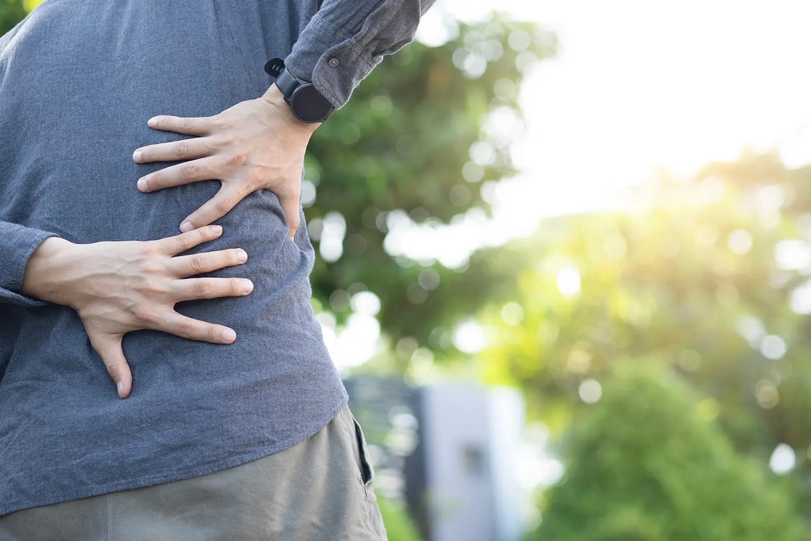 A man experiencing back pain.