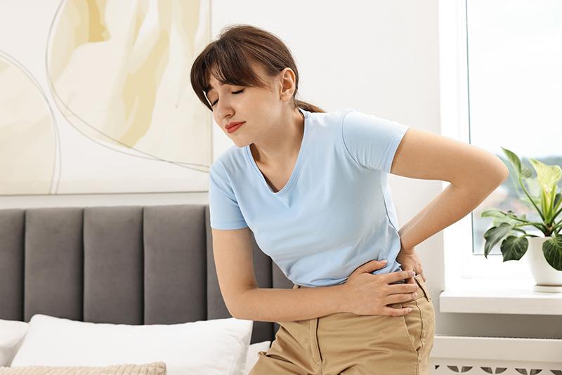Woman feeling back pain
