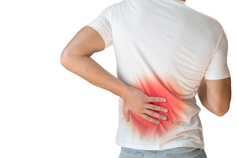 A young male experiencing back pain