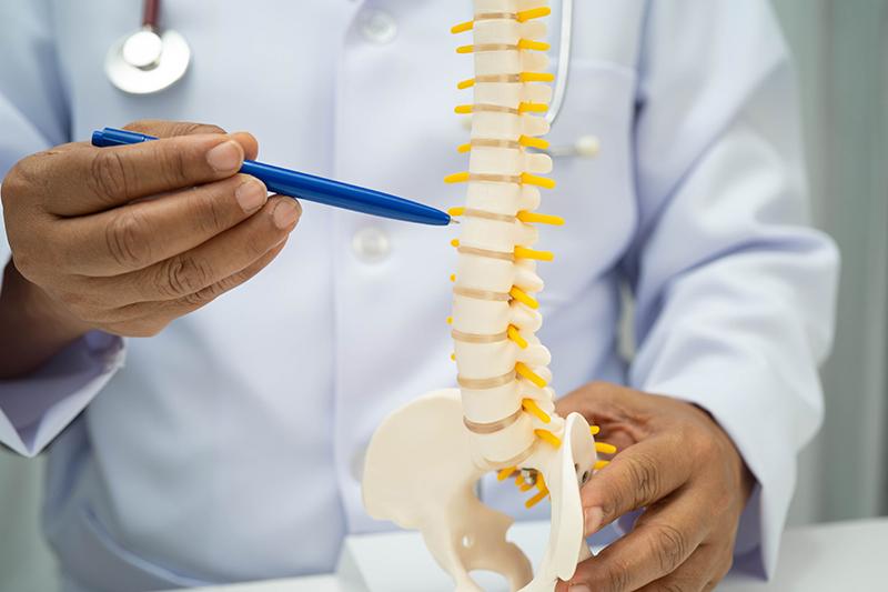 A specialist explaining slipped disc treatment options