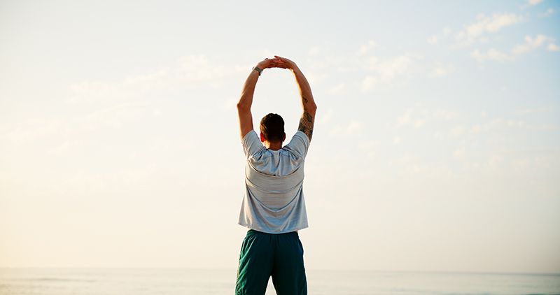 A man stretching his back freely