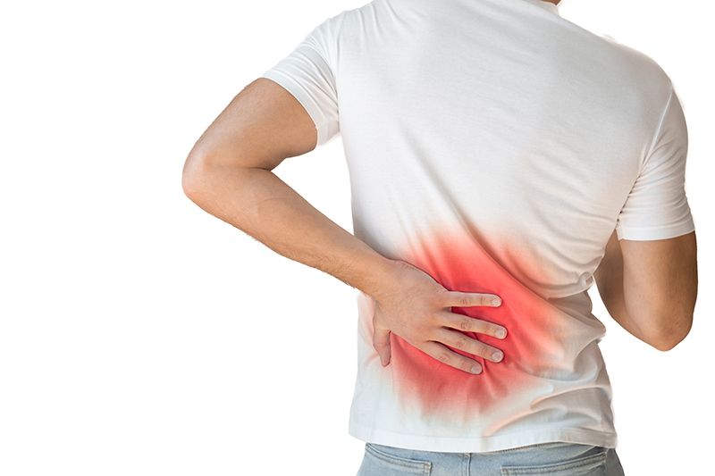 A young male experiencing back pain